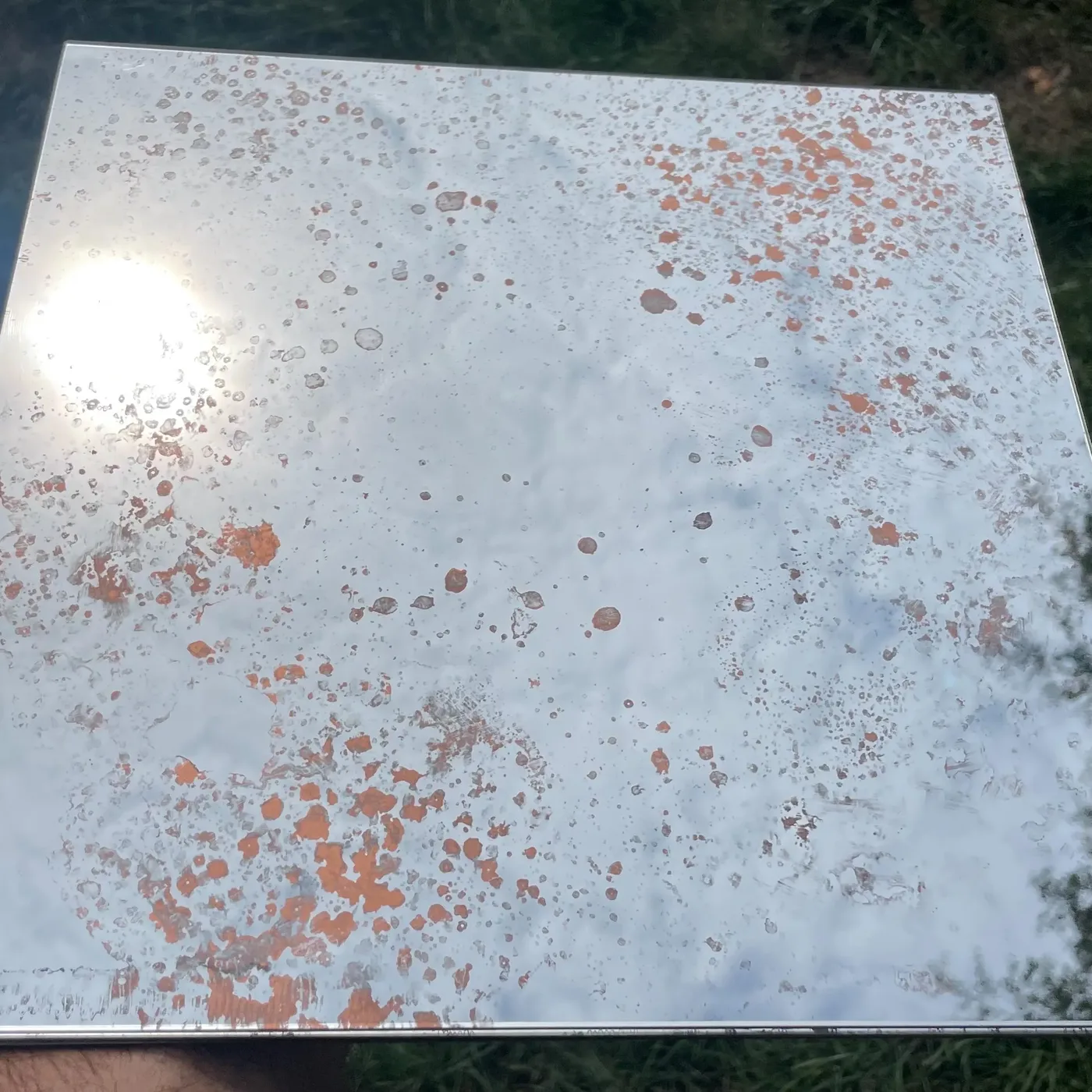 Copper antiqued and foxed distressed mirror tile, 30x30cm, handcrafted by Foxy Glass